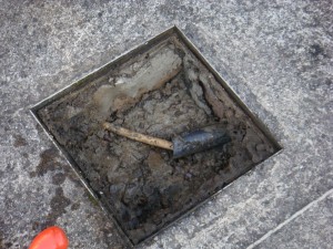 Service cover removed showing condition of service pipes in man hole during property survey