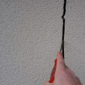 Widening crack in wall due to foundation settlement
