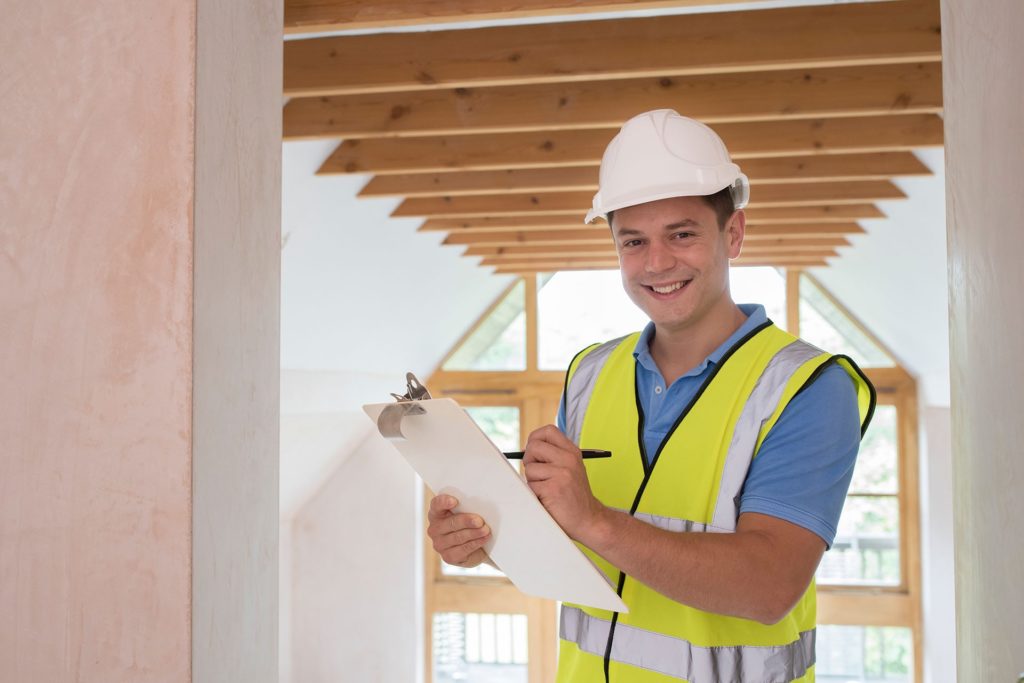 Male Engineer performing house survey