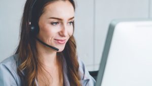 Female administrator on a headset providing property survey quotation cost