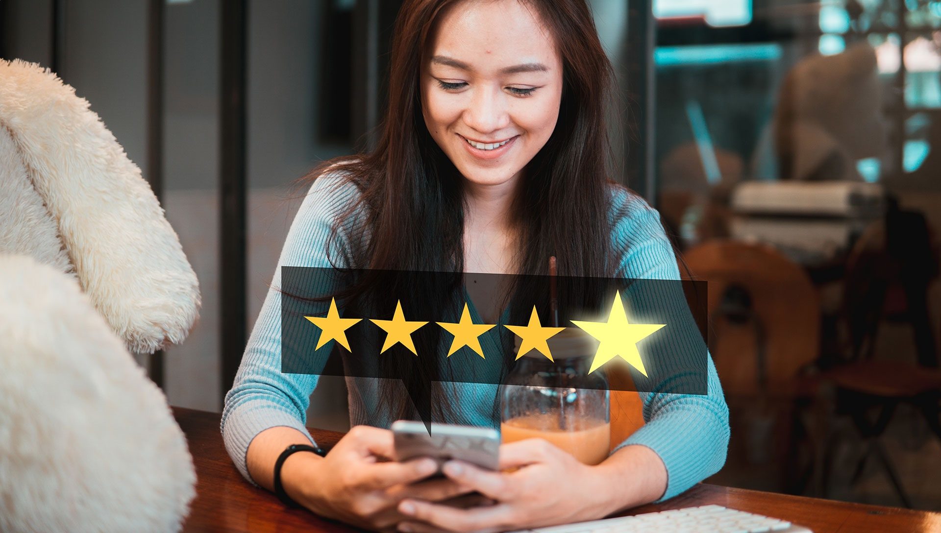 Female looking at phone giving 5 star review