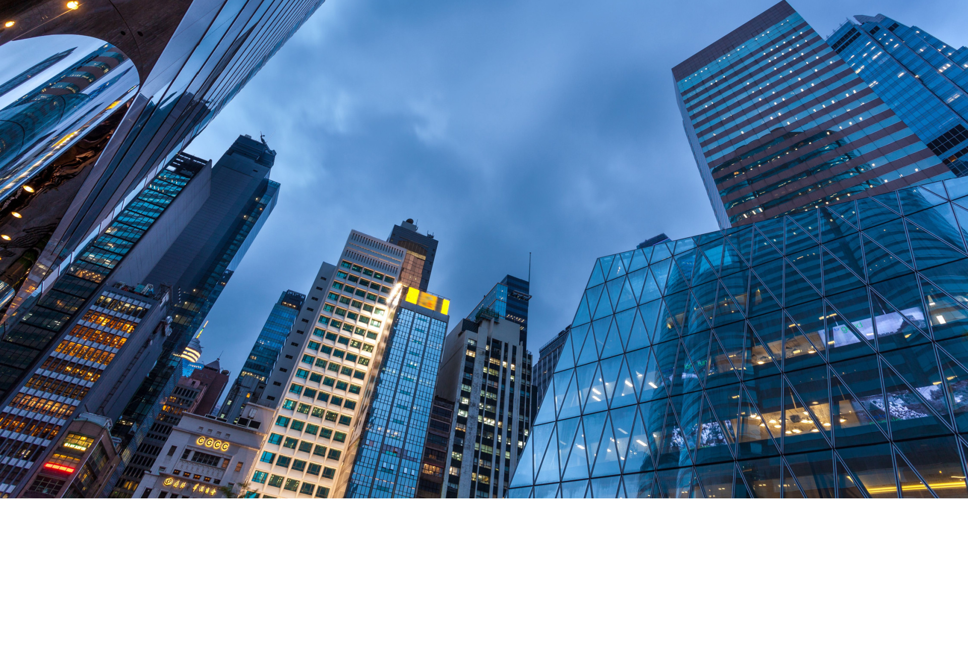 High rise buildings against dark sky